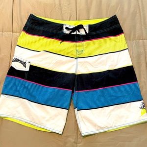 Quicksilver board shorts size 38, white, black, and neon: yellow, pink and blue.